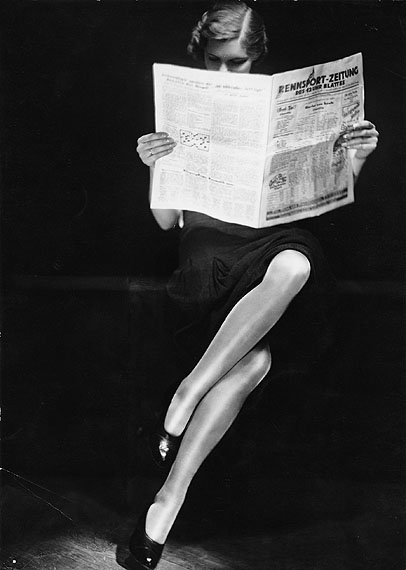 Yva Lady Reading Newspaper